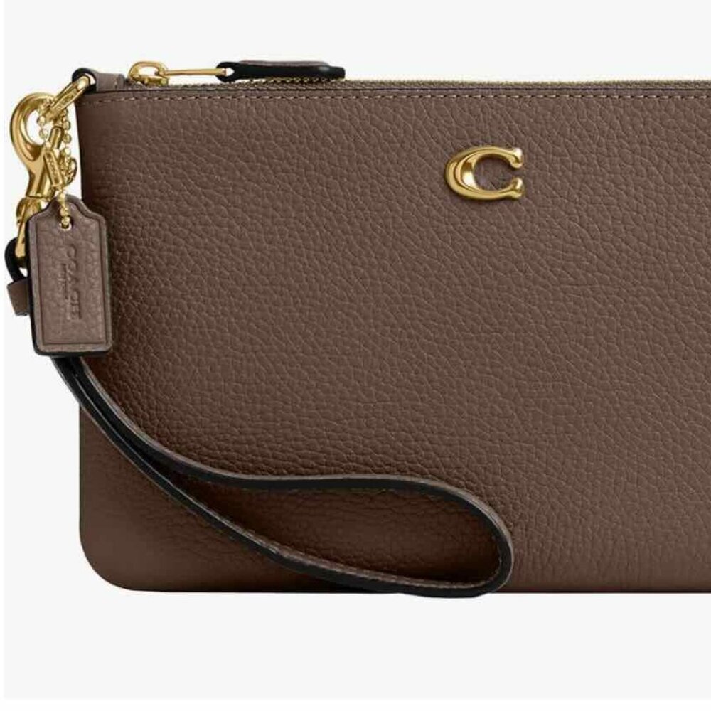 Like new COACH Essential Small Wristlet Dark Stone.  Retail. FAST SHIPPER